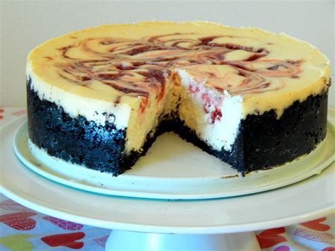 Maybe you would like to learn more about one of these? White Chocolate Raspberry Swirl Cheesecake - Say it With Cake