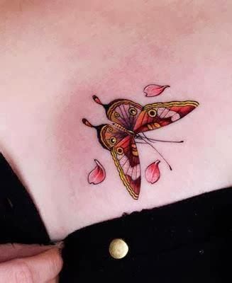 In a way, those butterfly tattoo meanings work very well together & are perfect for a woman who is proud of her femininity and also has the strength to get past the tough times in her life. Colorful butterfly tattoo on chest - World Amazing Tattoos