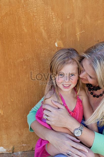 Mother Hugging Daughter Outdoors Picture And Hd Photos Free Download On Lovepik