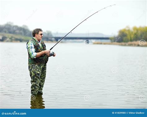 Fisherman Angling On The River Stock Photo Image Of Camouflage