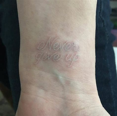 Body Tattoos Never Give Up White Ink Tattoo By Caitlin Finney