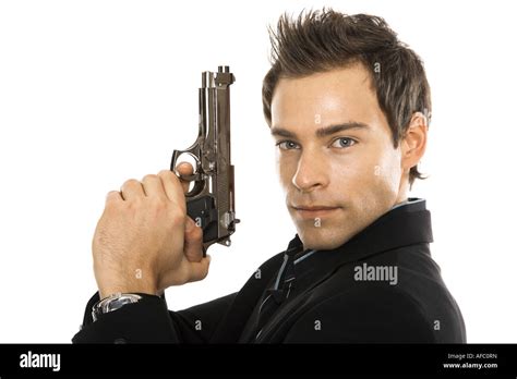 Young Man Holding Hand Gun Close Up Stock Photo Alamy