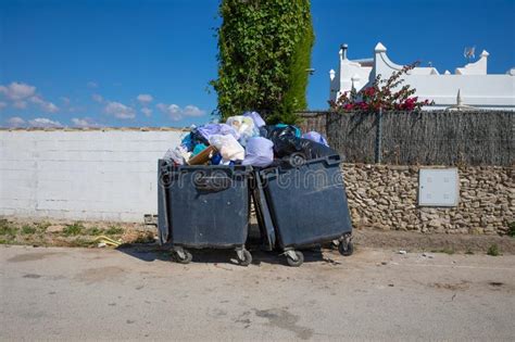 Two Full Garbage Containers In Street Stock Image Image Of Risk