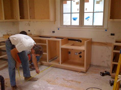Cabinet installers like the floor to be in place so that the cutting and dust from the floor installation will not damage the vanity. Cabinet Install Made Easy - Finish Carpentry - Contractor Talk
