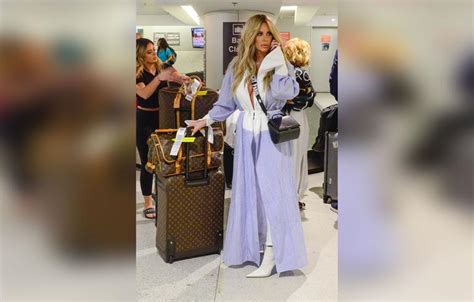 Kim Zolciak Flashes Boobs In Bizarre Robe Outfit At Airport