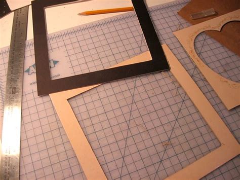 And finally, i sealed each of the images with my matte mod podge, which i always have on hand and use for everything. DIY photo mats- a great way to reuse old pieces of cardboard