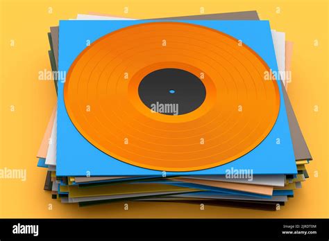 Black Vinyl Lp Record With Heap Of Covers Isolated On Yellow Background