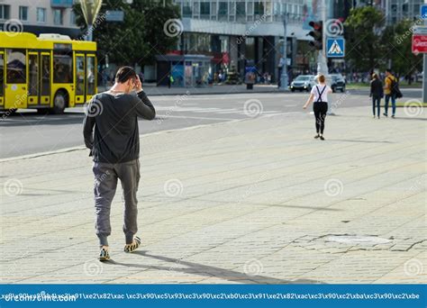 The Man Is Walking Down The Street Editorial Stock Photo Image Of