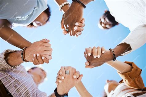 premium photo diversity support and people holding hands in trust and unity for community