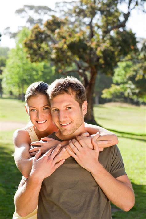 Woman Hugging Her Handsome Husband Stock Photo Image Of Natural Girl