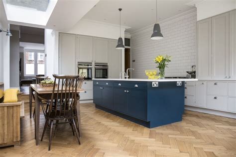 The combination options are endless; Hand painted kitchen island in Hague blue and yellow breakfast cabinet with walnut interiors ...