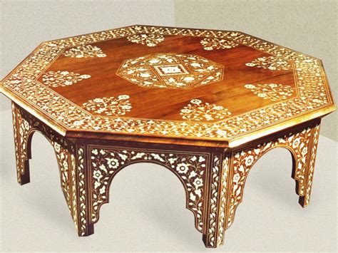 A very well crafted low table made utilizing an antique moroccan cart wheel and other cart pieces. Moroccan Coffee Table Design Images Photos Pictures