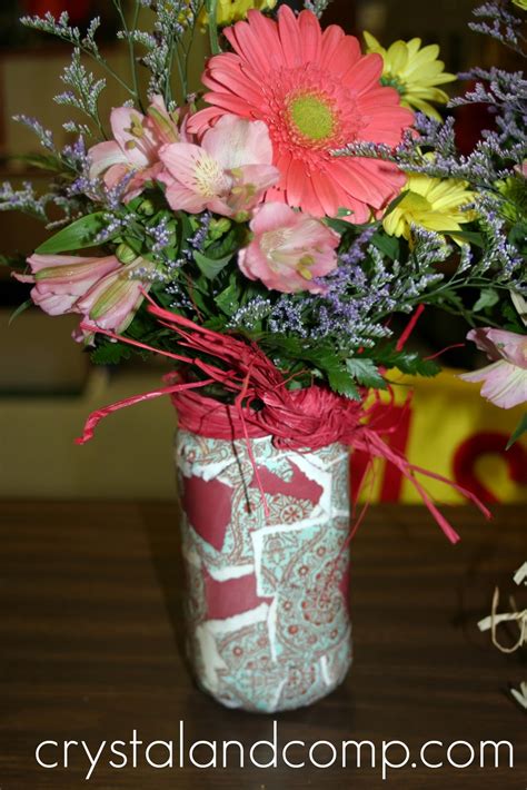 Learning how to arrange flowers in a tall vase is also usually easier as you can follow the contours of the vase itself, which can give direction to your extra tip: How to Make a Mod Podge Vase | CrystalandComp.com