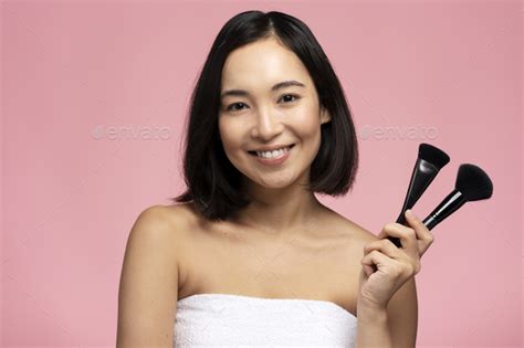 Image Of Joyful Half Naked Woman Smiling At Camera And Holding Makeup