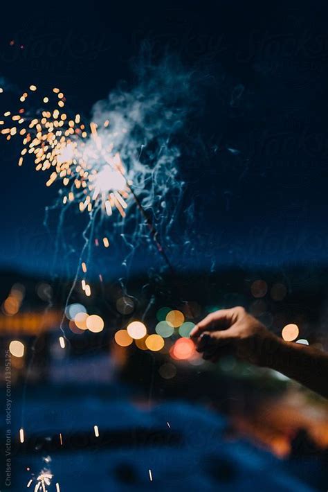 A Woman Holding A Sparkler In The City By Chelsea Victoria For Stocksy United Chelsea Victoria