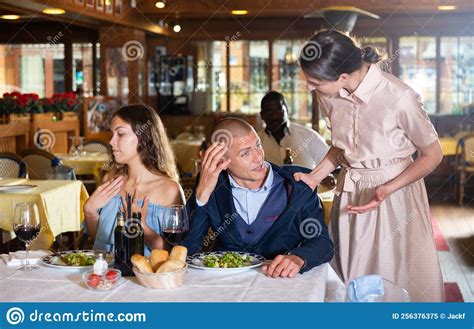 Wife Scolding Husband Spending Time With Another Woman In Restaurant Stock Image Image Of Food