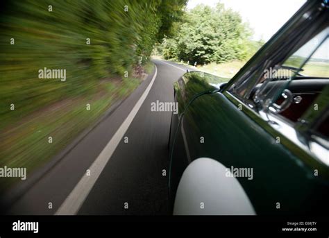 Car Driving Fast On Country Road Stock Photo Alamy