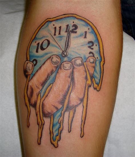 Melting Dali Clock Tattoo On Arm
