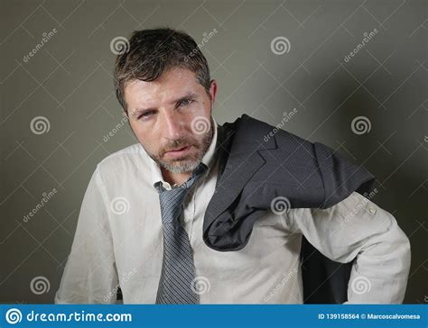 Young Attractive Sad And Worried Businessman In Lose Tie And Messy Look