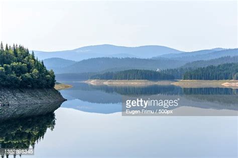 Scenic View Of Lake And Mountains Against Clear Sky High Res Stock