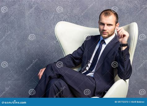 Brutal Businessmen In Suit With Tie Sitting On Chair Stock Image