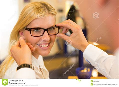 Optician or Optometrist Consulting a Customer about Eyeglasses Stock Image - Image of sight ...
