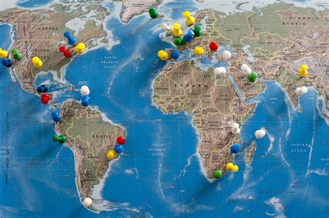 Free Stock Photo 10699 Multi Colored Thumb Tacks Inserted In World Map