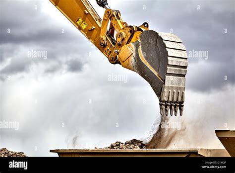 Construction Industry Heavy Equipment Excavator Moving Gravel At