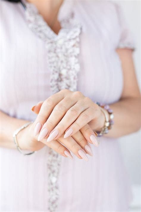 Female Hands With Light Pink Nude Nail Polish Stock Image Image Of