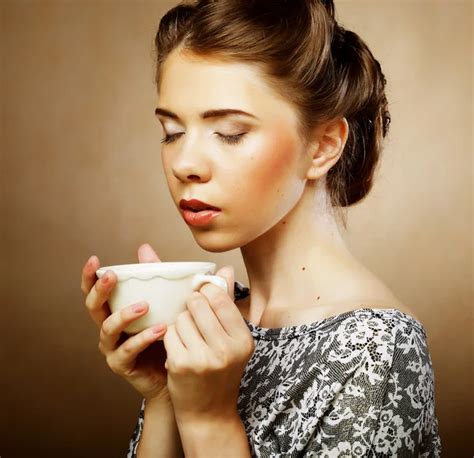 Coffee Beautiful Girl Drinking Tea Or Coffee Stock Photo By ©subbotina