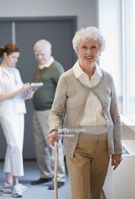 Senior Woman Walking With Cane High Res Stock Photo Getty Images