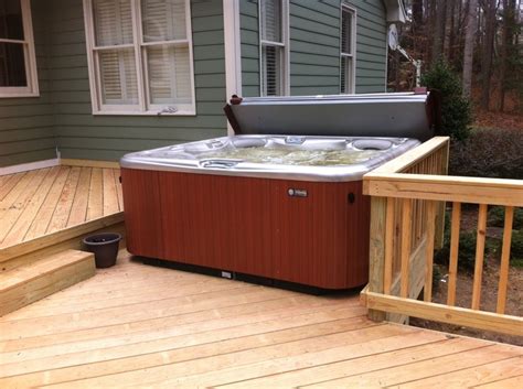 hot spring aria installed on a custom deck with a cover cradle this hot spring grandee is