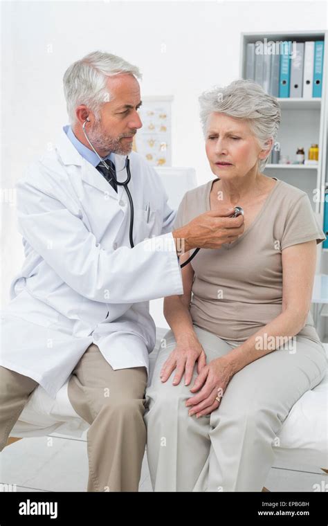 Doctor Checking Patients Heartbeat Using Stethoscope Stock Photo Alamy