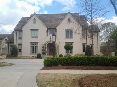 Cedar shake roof maintenance includes the following: Newhave home designed by Mitch Ginn - coated brick - cedar ...