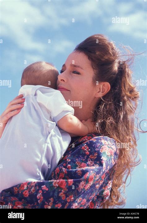 Mother Holding Her Baby Boy Stock Photo Alamy