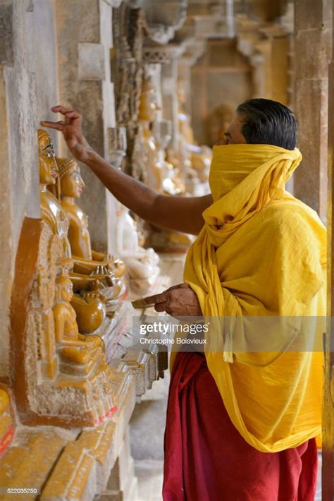 Jain Priest Worshipping The Idols Of The 24 Tirthankaras High Res Stock