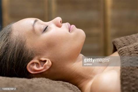 black woman massaging face photos and premium high res pictures getty images