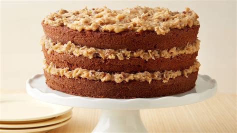 Two layers of tender chocolate cake topped with a decadent coconut pecan frosting. German Chocolate Cake with Coconut-Pecan Frosting recipe ...