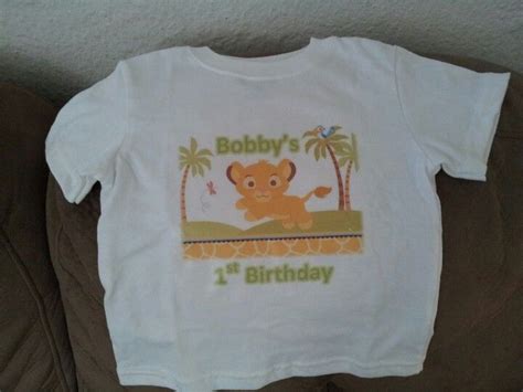 I justified this expense by telling myself that he would wear it more than just once. DIY baby simba birthday shirt. Found image on google, added text using Word, printed on iron on ...