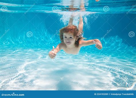 Underwater Kid In The Swimming Pool Child Swim And Dive Underwater