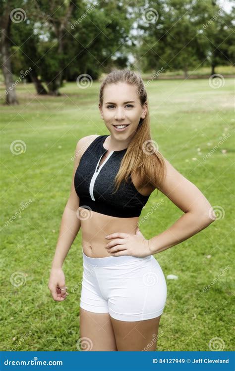 Caucasian Teen Woman Exercise Shorts And Top In Park Stock Image