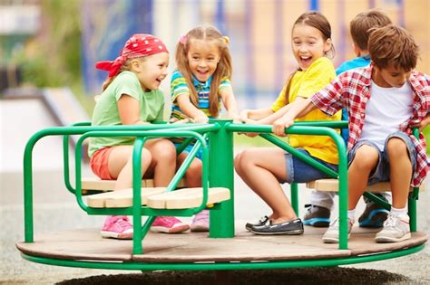 Kids Having Fun On Carousel Photo Free Download