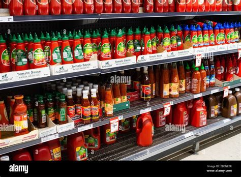 Assorted Bottles Of Sauce On An Australian Supermarket Shelf Stock