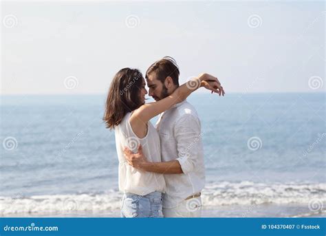Romantic Young Couple On The Beach Kissing Stock Image Image Of