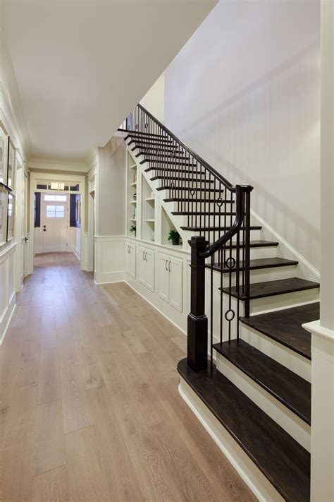 Classic Hallway And Stairs Light Hardwood Floors Hardwood Stairs