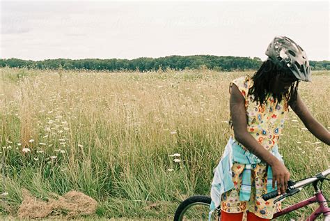 Black Girl On A Bike Ride By Stocksy Contributor Gabriel Gabi