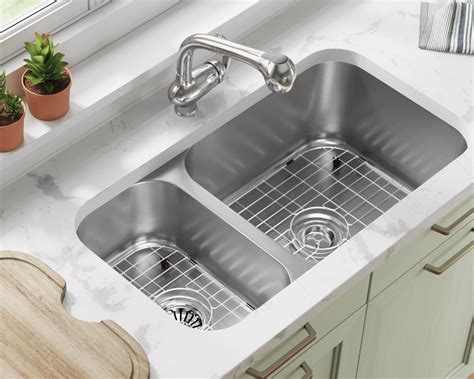 It is a very deep sink with a lot of sound dampening material around it. 3218BR-SLW Offset Double Bowl Undermount Stainless Steel ...