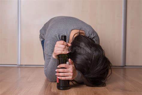 Sad Depressed Alcoholic Drunk Woman Drinking At Home Stock Image