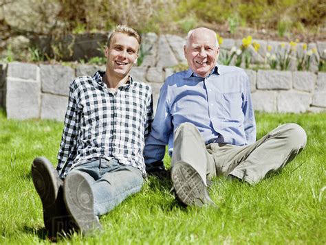 Old Man And Young Man On Lawn Stock Photo Dissolve