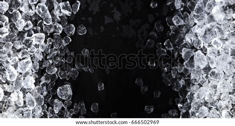 Pieces Of Crushed Ice Cubes On Black Background Copy Space Top View